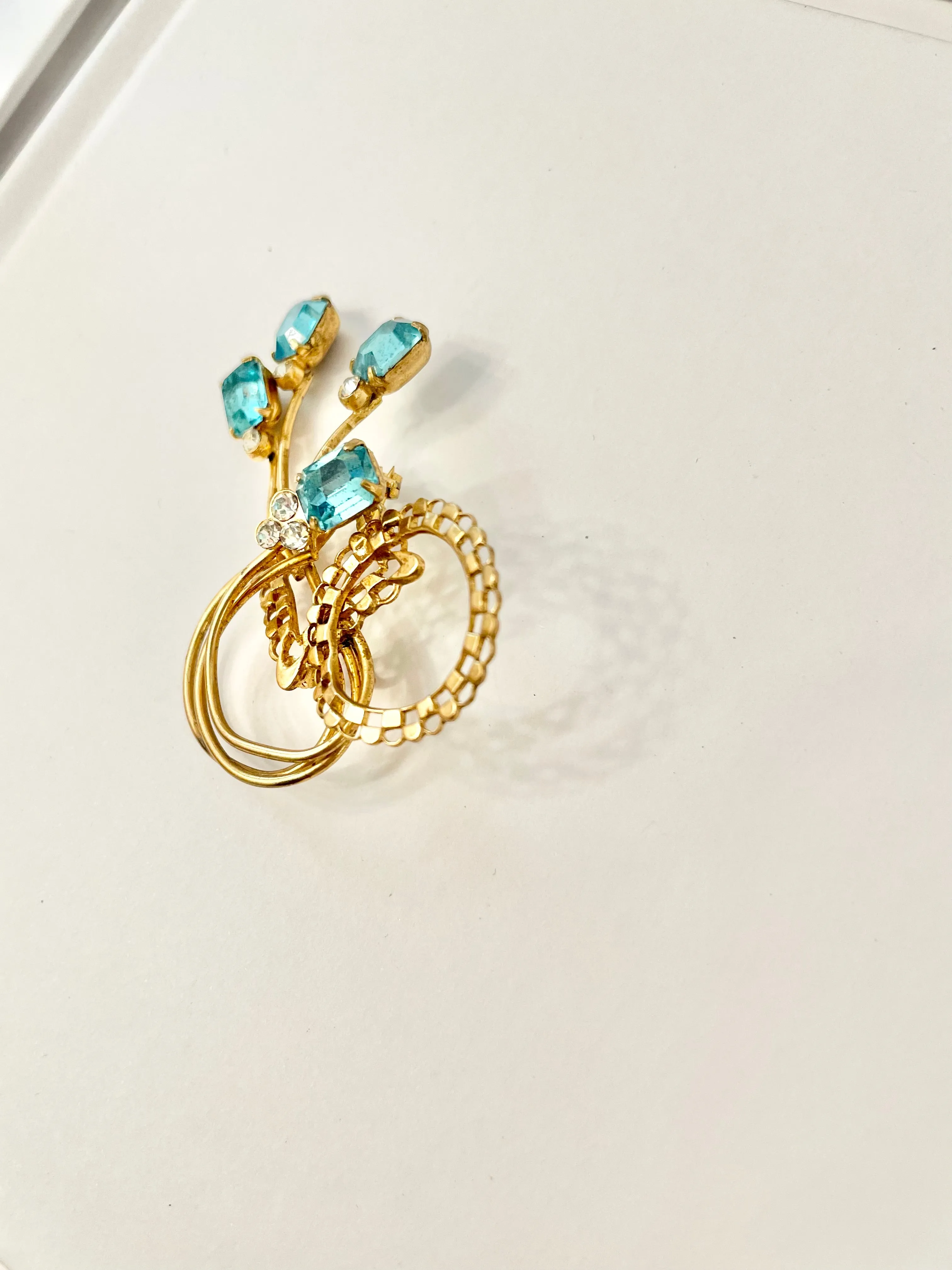 1960's divine gold brooch with emerald cut glass stones.... so classy!