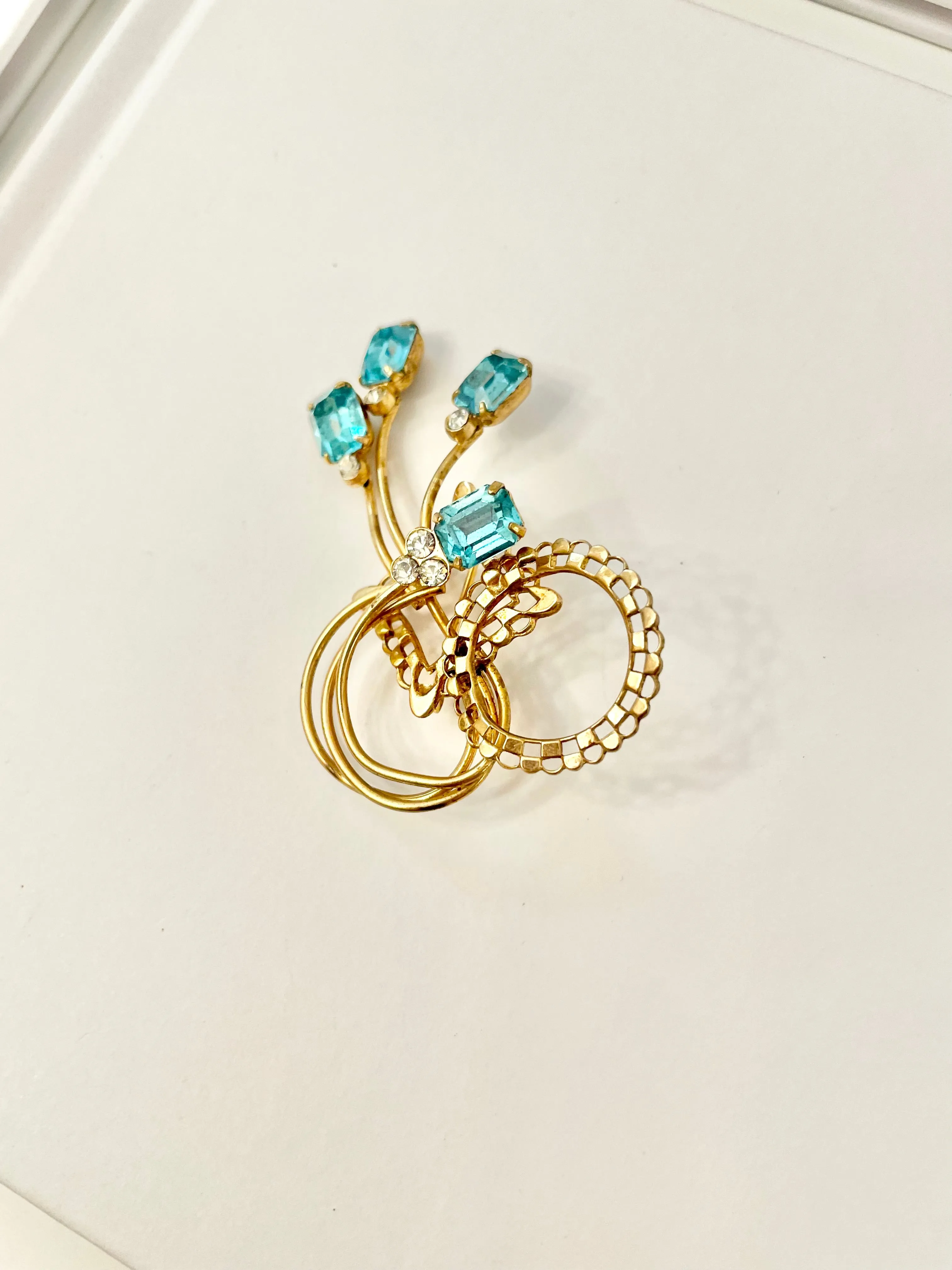 1960's divine gold brooch with emerald cut glass stones.... so classy!