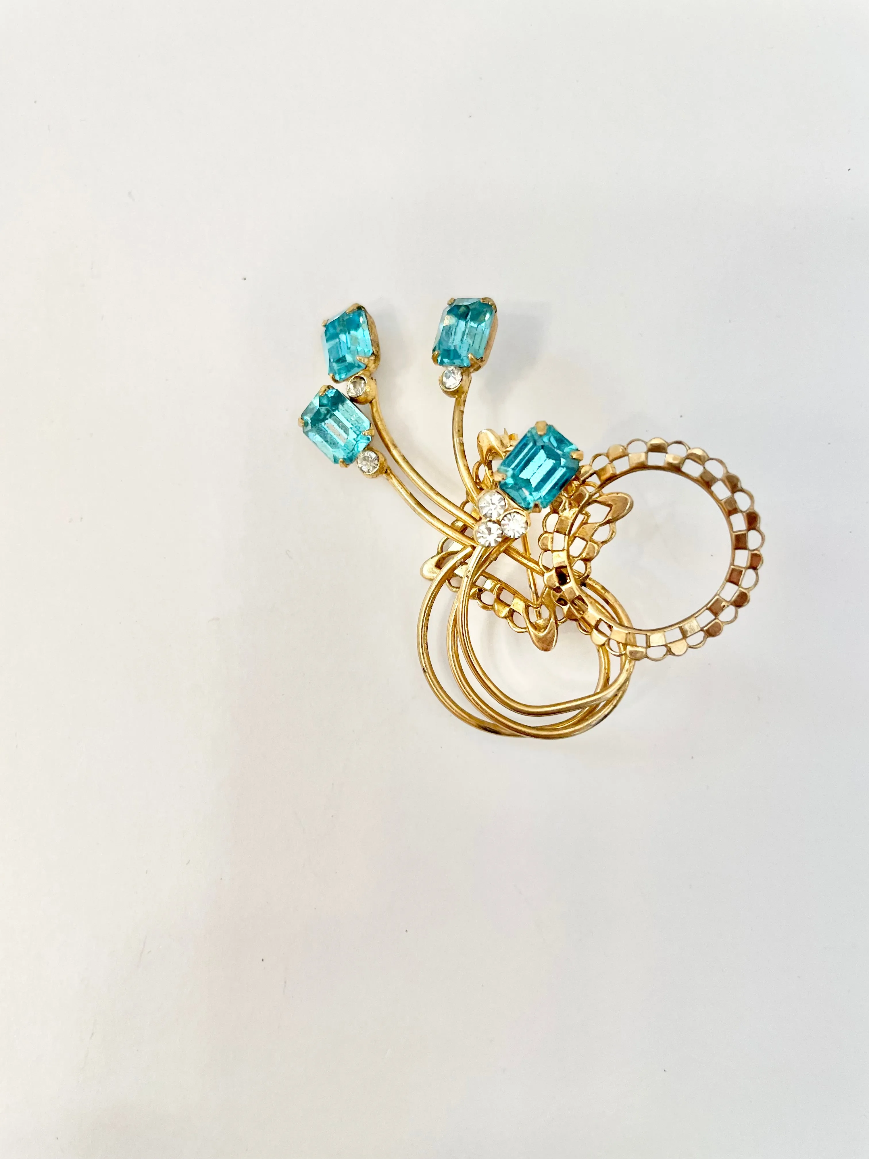 1960's divine gold brooch with emerald cut glass stones.... so classy!