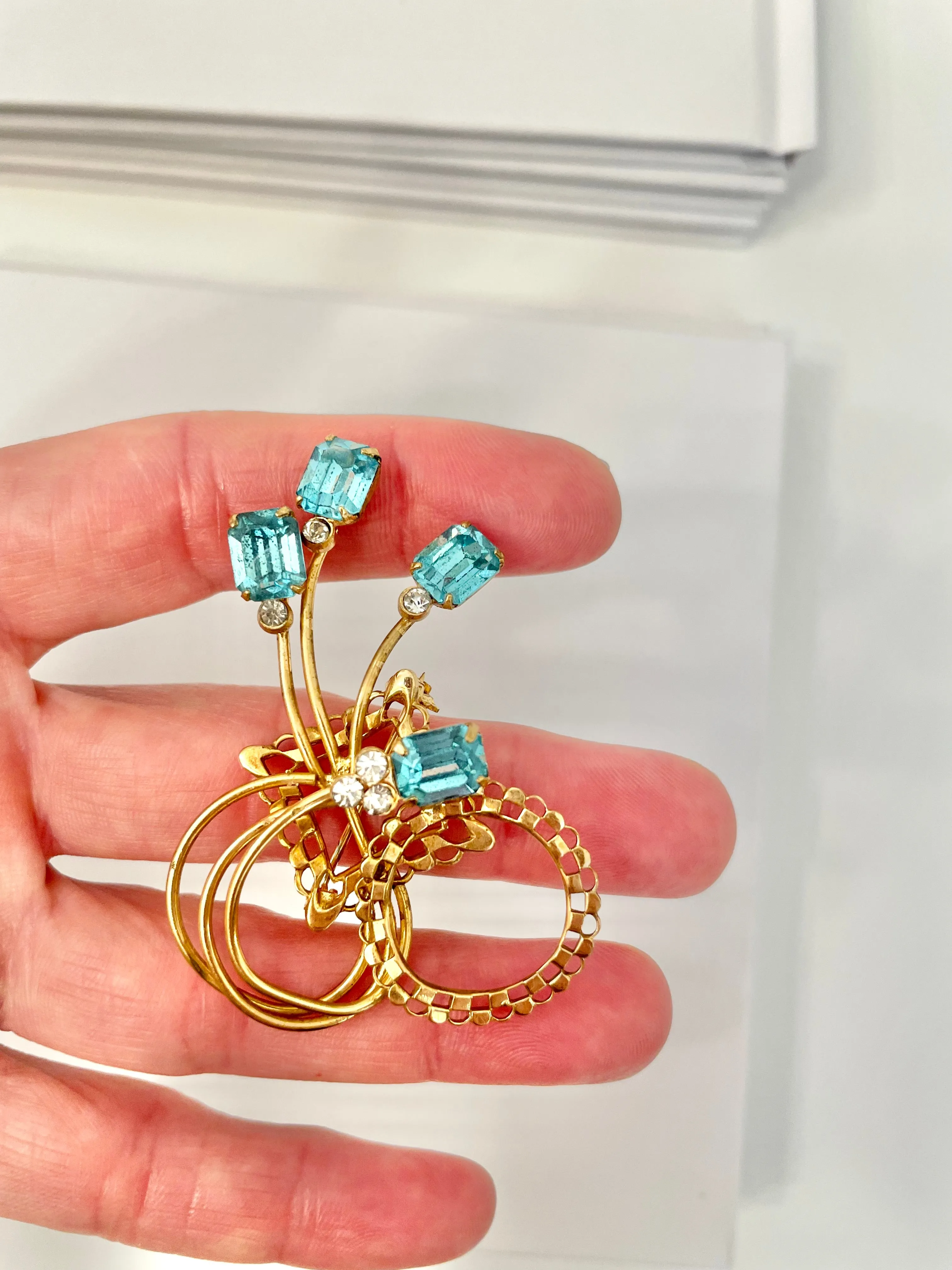 1960's divine gold brooch with emerald cut glass stones.... so classy!