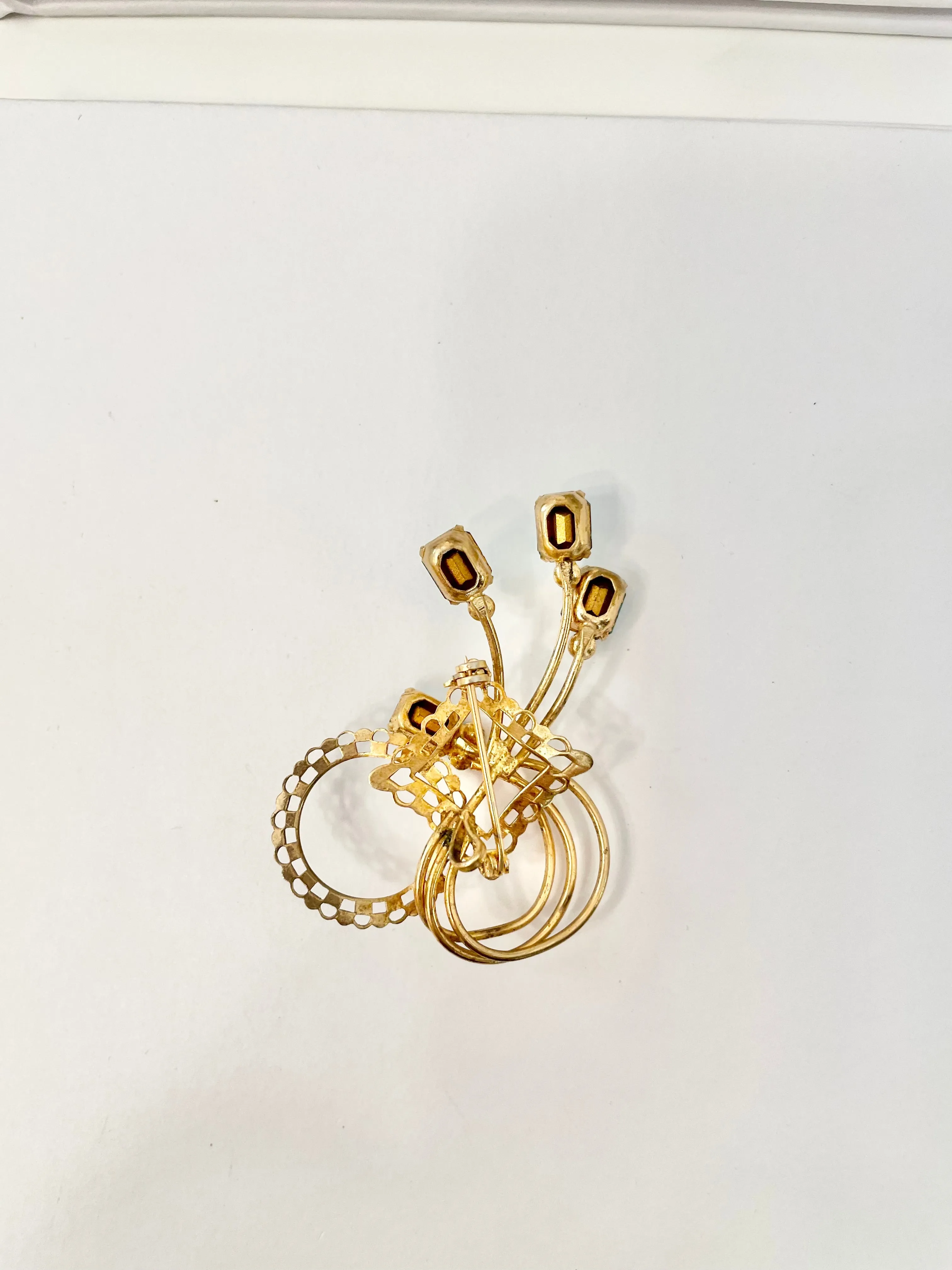 1960's divine gold brooch with emerald cut glass stones.... so classy!