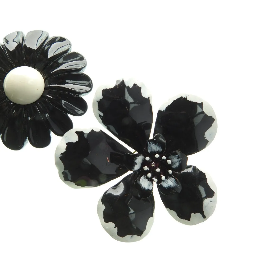 Lot of two black and white vintage enamel flower brooches