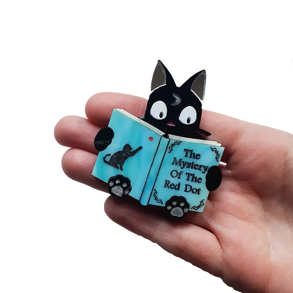 Mystery Of The Red Dot Brooch by Cherryloco
