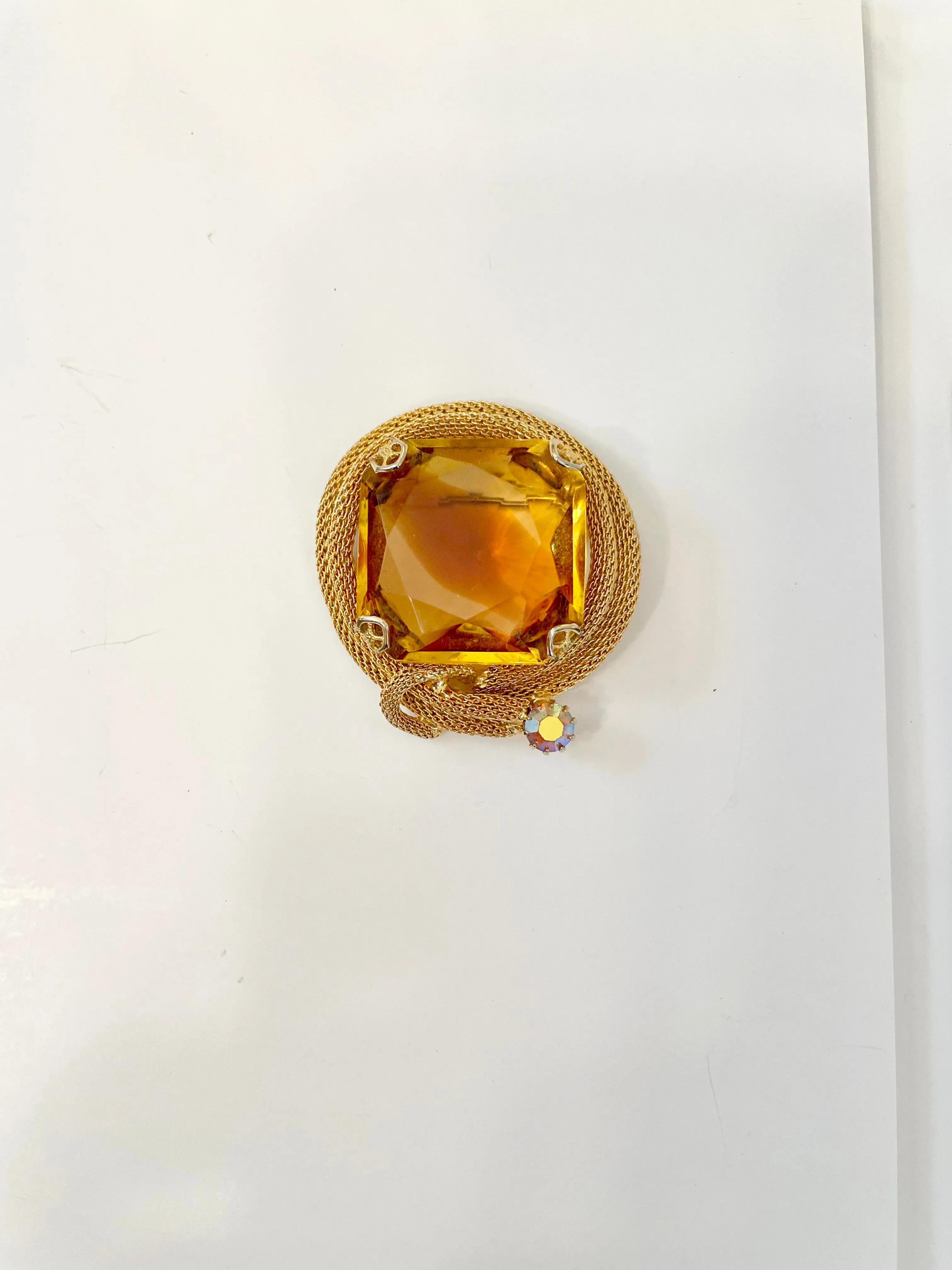 Rich and oh so classy! This stunning citrine colored glass brooch is truly chic!