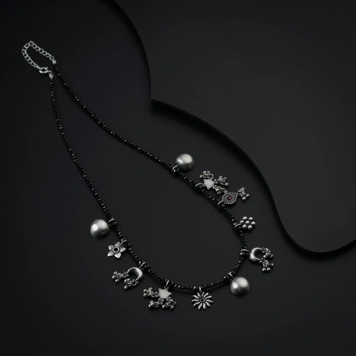 Silver Charms Motifs Necklace with Black Spinel