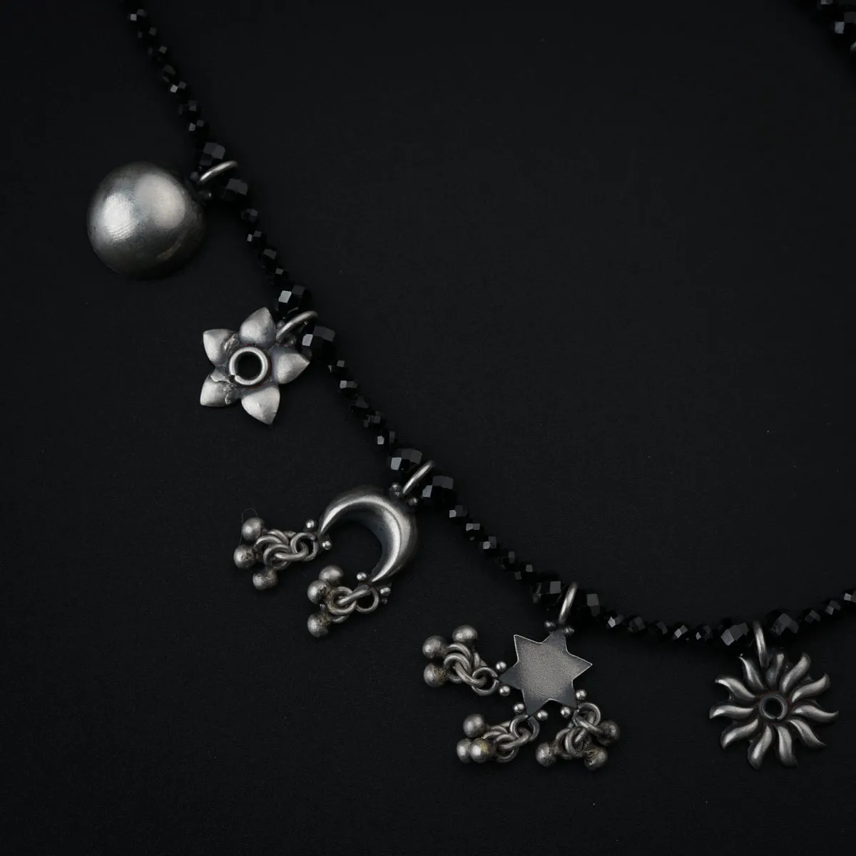 Silver Charms Motifs Necklace with Black Spinel